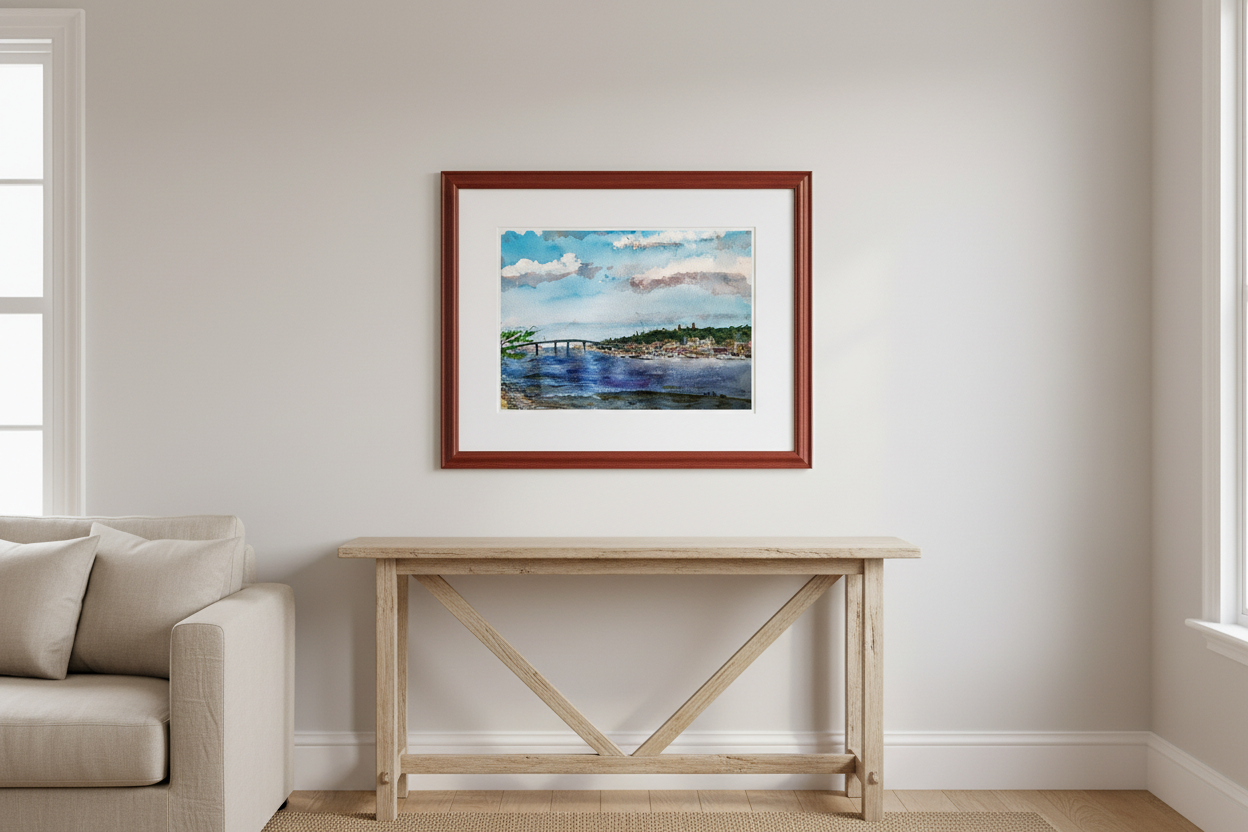 Atlantic Highlands from Sandy Hook watercolor painting framed in cherry wood with white mat, displayed in a coastal living room