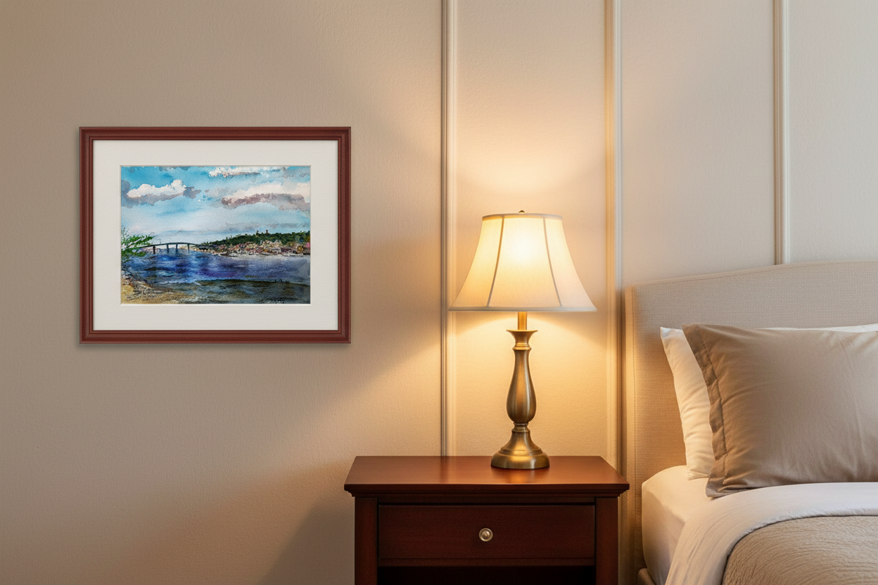Atlantic Highlands from Sandy Hook watercolor painting framed in cherry wood with white mat, displayed in a bedroom beside a nightstand