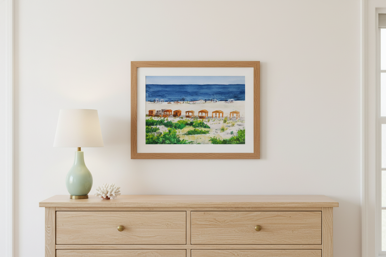 View from the Balcony watercolor in natural wood frame above coastal bedroom dresser